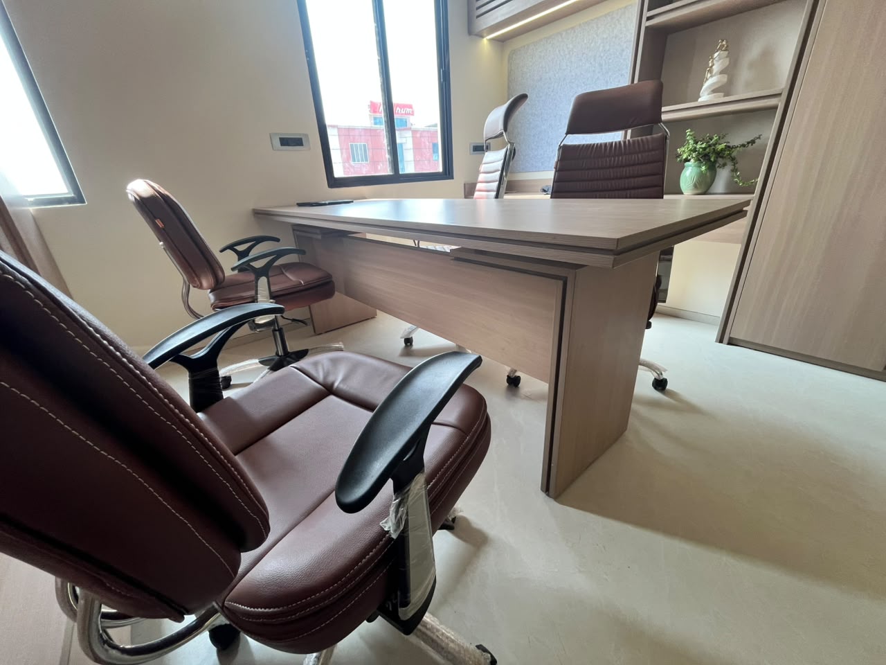 Executive desk with leather chairs