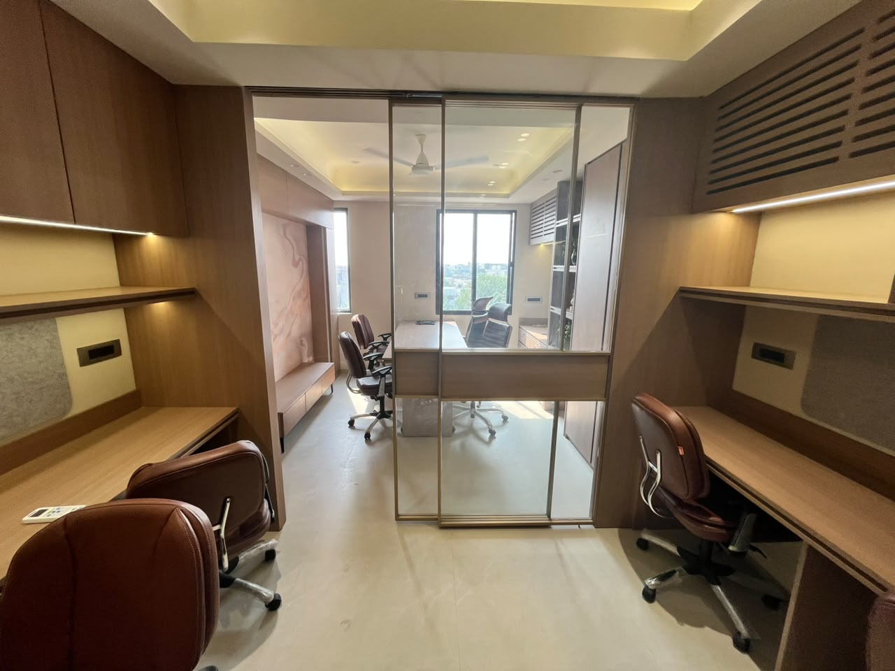 Glass partition separating office cabins — Corporate Office Suite by EMA